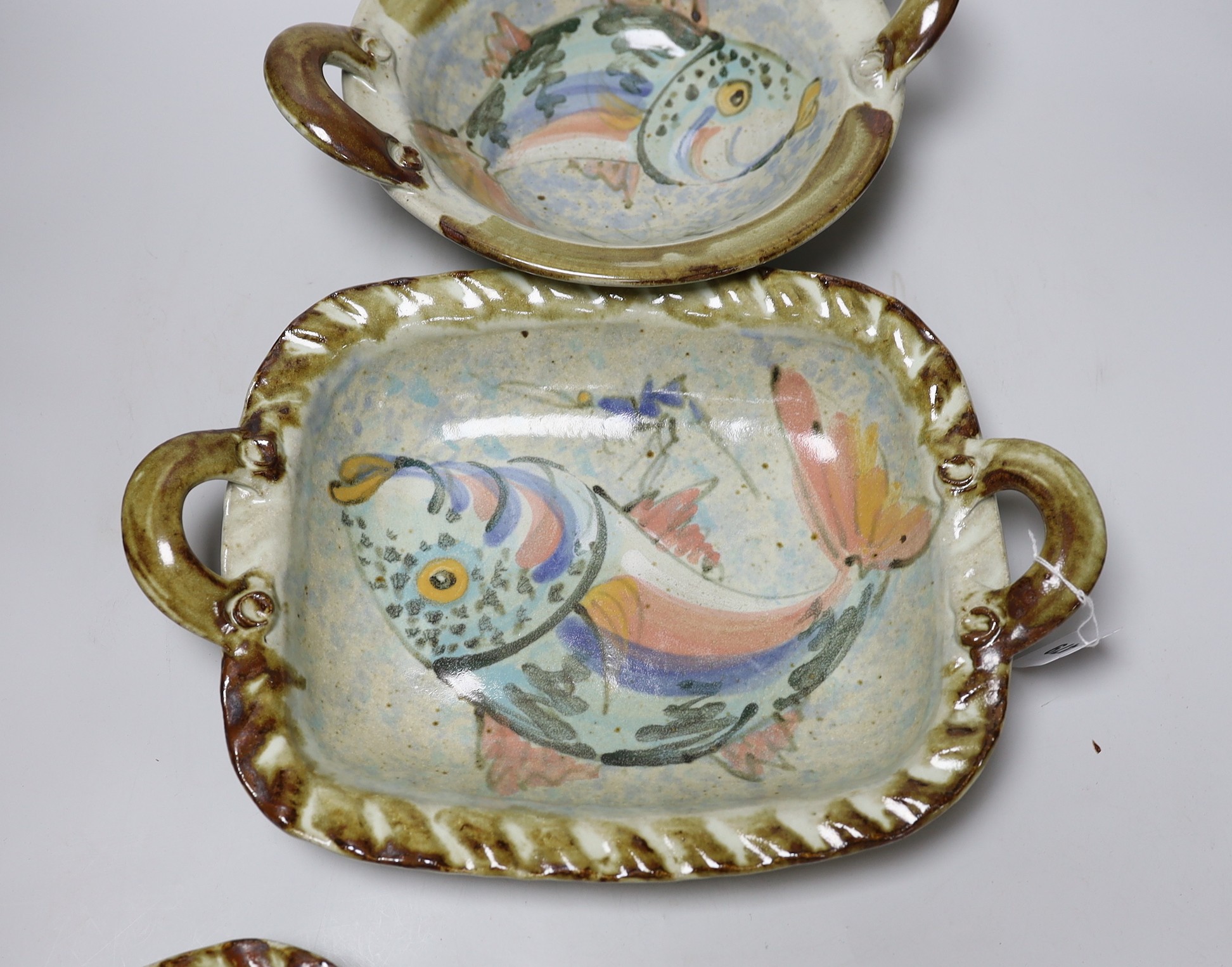 Three Roger Cockram pottery two handled dishes, largest 37cms